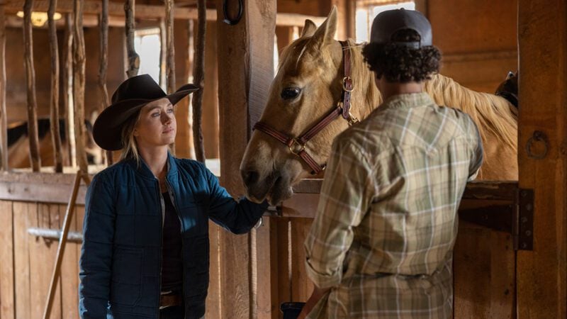 Amber Marshall (as Amy) and a horse in Heartland.