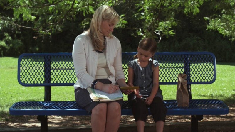 Adult with Child on park bench